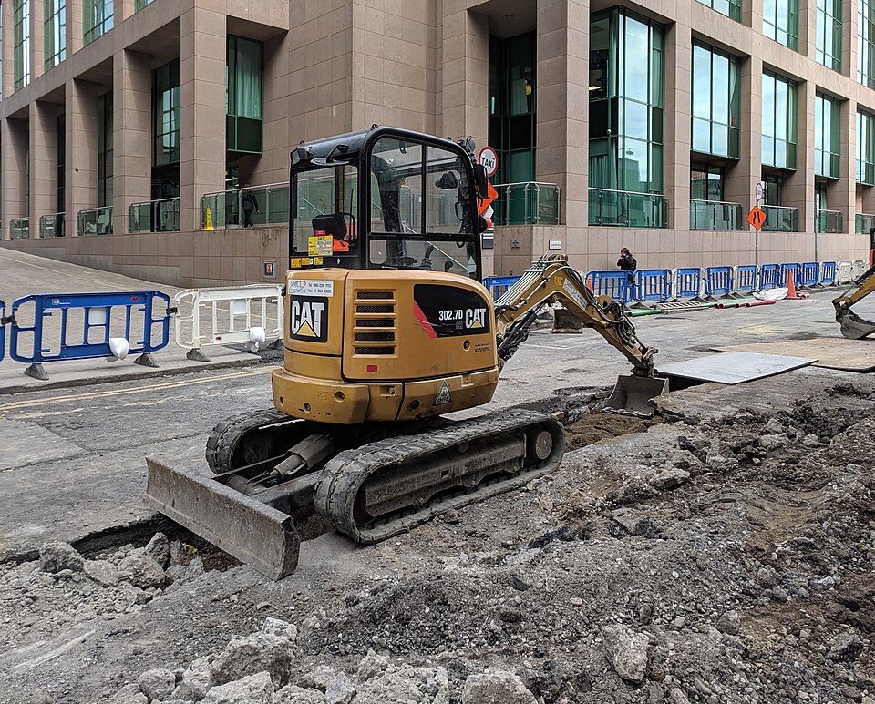 Compact Caterpillar mini excavator on rubber tracks