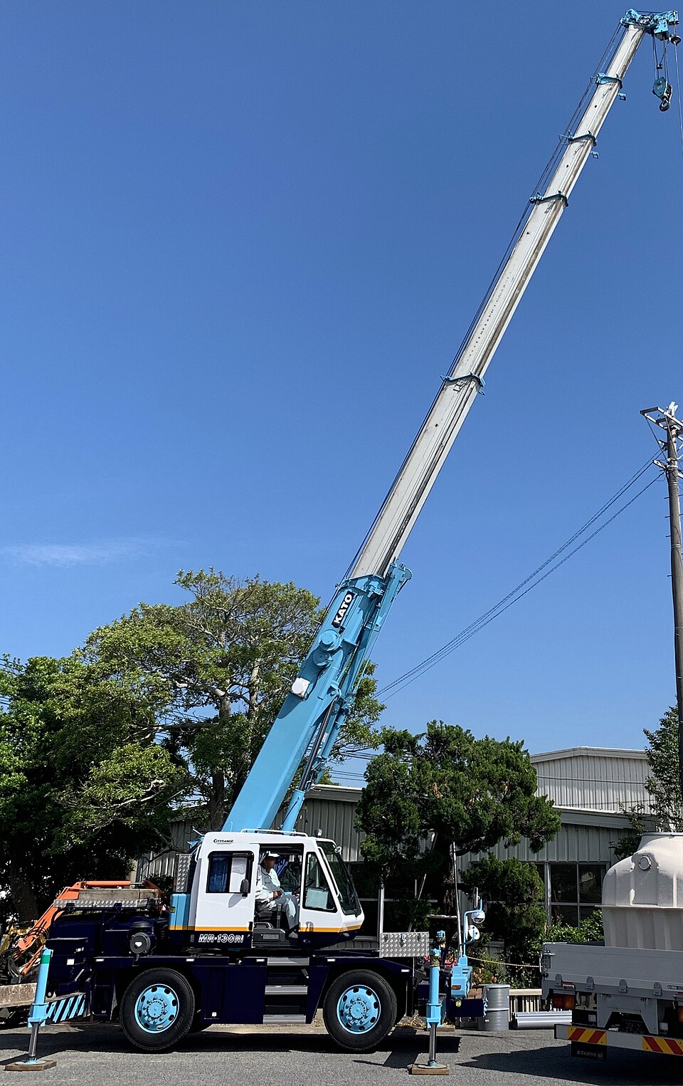 Kato rough terrain crane with a telescopic boom and outriggers